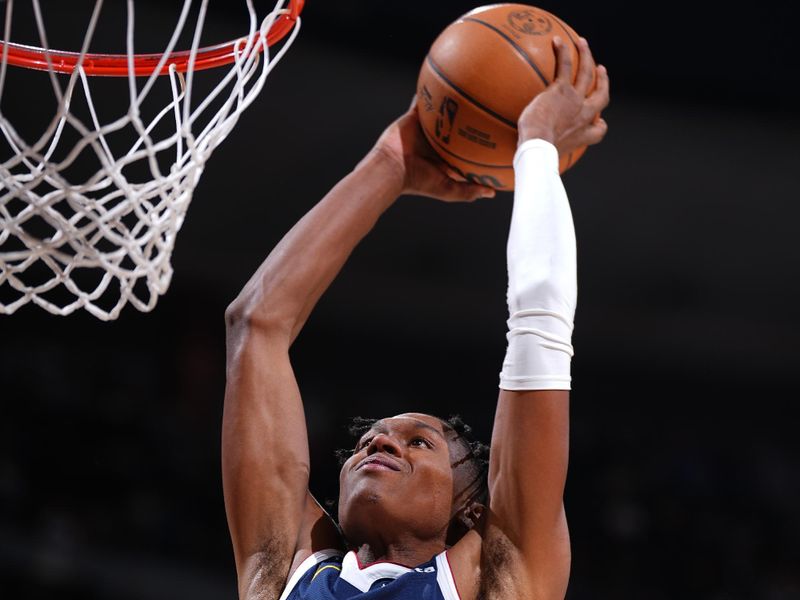 DENVER, CO - NOVEMBER 6: Peyton Watson #8 of the Denver Nuggets dunks the ball during the game against the Oklahoma City Thunder on November 6, 2024 at Ball Arena in Denver, Colorado. NOTE TO USER: User expressly acknowledges and agrees that, by downloading and/or using this Photograph, user is consenting to the terms and conditions of the Getty Images License Agreement. Mandatory Copyright Notice: Copyright 2024 NBAE (Photo by Garrett Ellwood/NBAE via Getty Images)