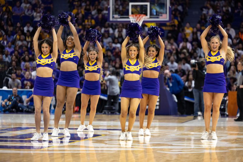 Mar 22, 2024; Baton Rouge, Louisiana, USA; LSU Lady Tigers cheerleaders perform against the Rice Owls during the first half at Pete Maravich Assembly Center. Mandatory Credit: Stephen Lew-USA TODAY Sports