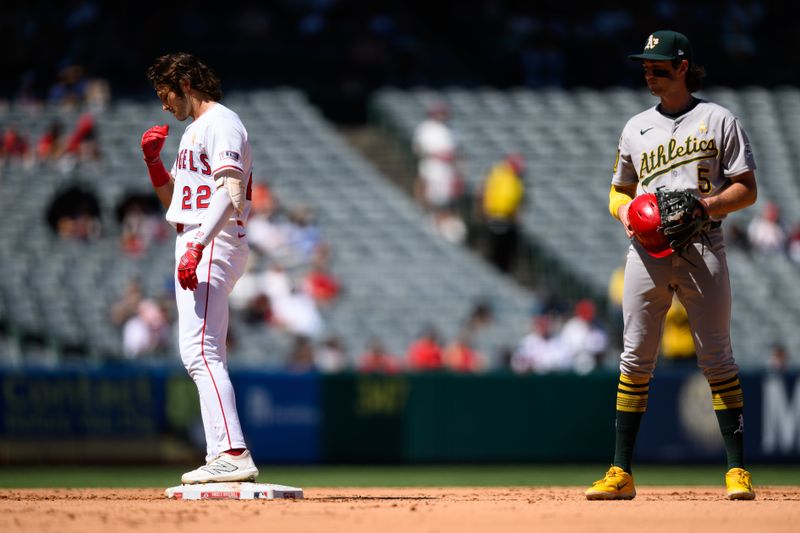 Sep 7, 2025; Anaheim, California, USA; Los Angeles Angels center fielder Bryce Teodosio (22), left, gestures after hitting a RBI double against the Athletics during the fourth inning at Angel Stadium. Mandatory Credit: William Liang-Imagn Images