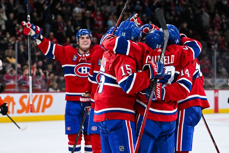 Feb 13, 2024; Montreal, Quebec, CAN; Montreal Canadiens center Nick Suzuki (14) celebrates his second goal of the game against the Anaheim Ducks with his teammates during the second period at Bell Centre. Mandatory Credit: David Kirouac-USA TODAY Sports