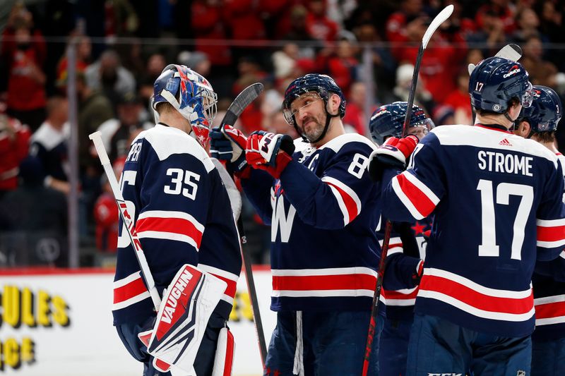 Jan 7, 2024; Washington, District of Columbia, USA; Washington Capitals left wing Alex Ovechkin (8) celebrates with Capitals goaltender Darcy Kuemper (35) after defeating the Los Angeles Kings at Capital One Arena. Mandatory Credit: Amber Searls-USA TODAY Sports