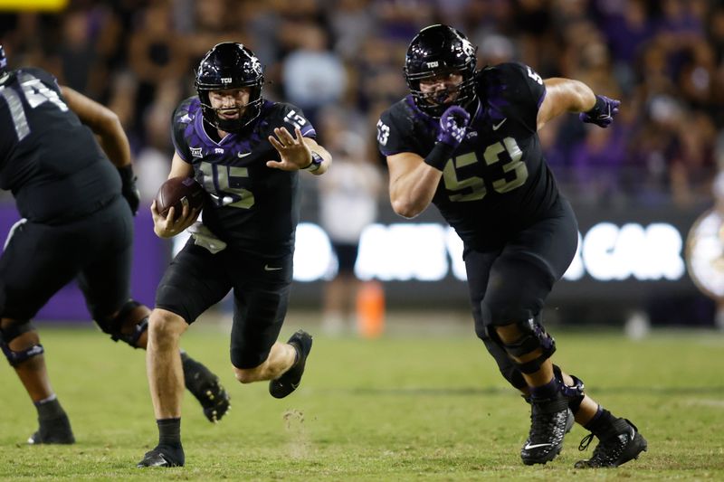 Oct 22, 2022; Fort Worth, Texas, USA; TCU Horned Frogs quarterback Max Duggan (15) runs for a first down as guard John Lanz (53) looks to block against the Kansas State Wildcats at Amon G. Carter Stadium. Mandatory Credit: Tim Heitman-USA TODAY Sports