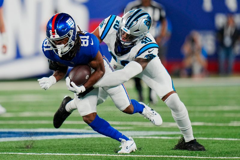 New York Giants wide receiver Kalil Pimpleton (81) is tackled by Carolina Panthers linebacker Brandon Smith (40) during an NFL pre-season football game on Friday, Aug. 18, 2023, in East Rutherford, N.J. (AP Photo/Rusty Jones)