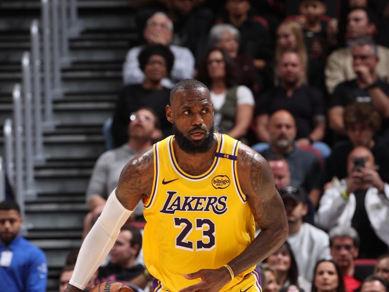 MIAMI, FL - DECEMBER 4: LeBron James #23 of the Los Angeles Lakers handles the ball during the game against the Miami Heat on December 4, 2024 at Kaseya Center in Miami, Florida. NOTE TO USER: User expressly acknowledges and agrees that, by downloading and or using this Photograph, user is consenting to the terms and conditions of the Getty Images License Agreement. Mandatory Copyright Notice: Copyright 2024 NBAE (Photo by Joe Murphy/NBAE via Getty Images)