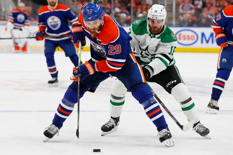 May 27, 2024; Edmonton, Alberta, CAN;   Edmonton Oilers forward Leon Draisaitl (29) protects the puck from Dallas Stars forward Sam Steel (18) during the third period in game three of the Western Conference Final of the 2024 Stanley Cup Playoffs at Rogers Place. Mandatory Credit: Perry Nelson-USA TODAY Sports