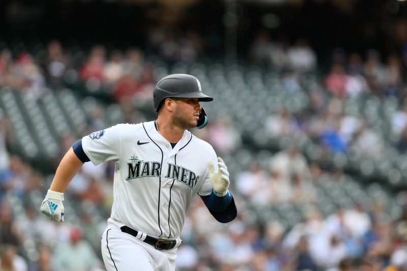 Jun 27, 2023; Seattle, Washington, USA; Seattle Mariners first baseman Ty France (23) runs towards first base after hitting a single against the Washington Nationals during the first inning at T-Mobile Park. Mandatory Credit: Steven Bisig-USA TODAY Sports