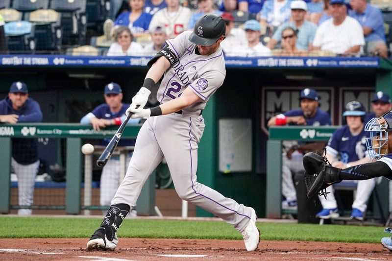 Jun 2, 2023; Kansas City, Missouri, USA; Colorado Rockies third baseman Ryan McMahon (24) hits a solo home run against the Kansas City Royals in the first inning at Kauffman Stadium. Mandatory Credit: Denny Medley-USA TODAY Sports