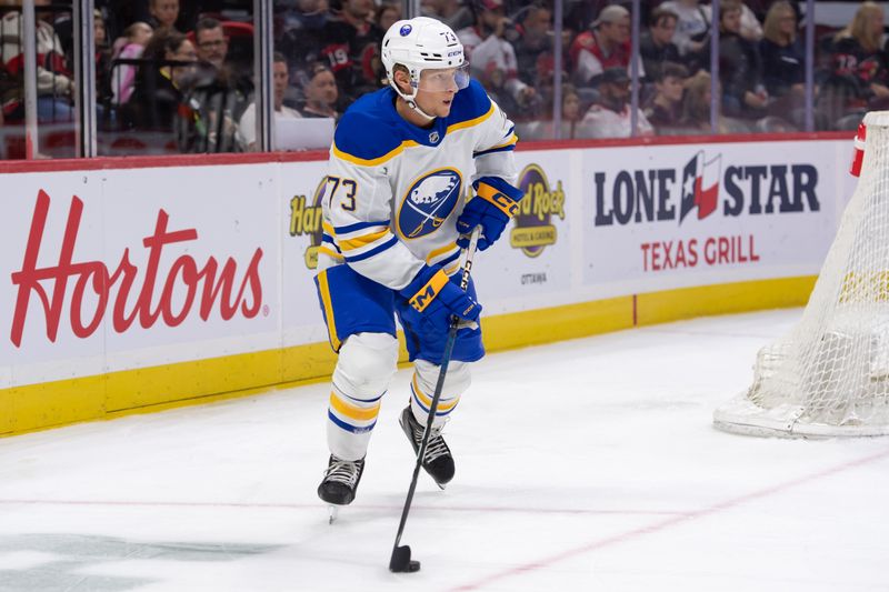 Sep 26, 2024; Ottawa, Ontario, CAN; Buffalo Sabres defenseman Zach Metsa (73) skates with the puck in the first period against the Ottawa Senators at the Canadian Tire Centre. Mandatory Credit: Marc DesRosiers-Imagn Images