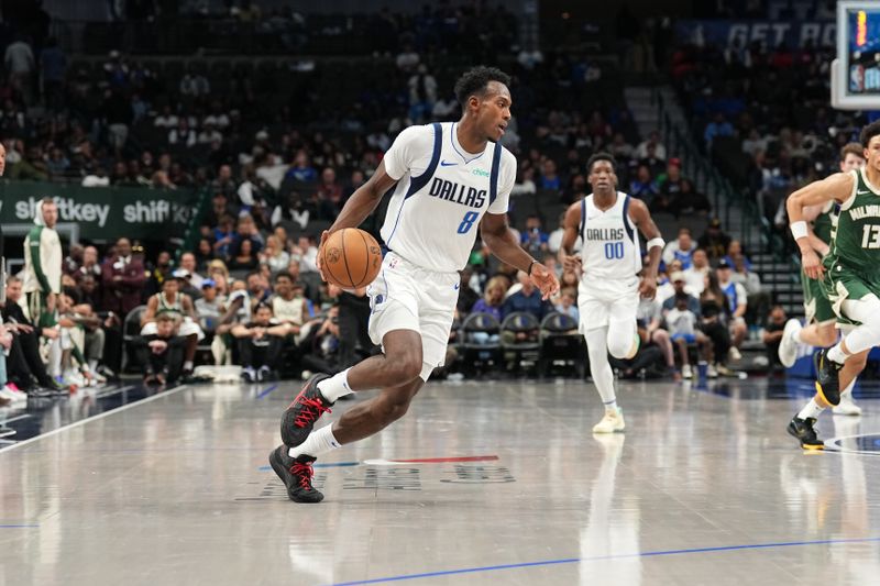 DALLAS, TX - OCTOBER 17: Olivier Maxence-Prosper #8 of the Dallas Mavericks dribbles the ball during the game against the Milwaukee Bucks during a NBA preseason game on October 17, 2024 at American Airlines Center in Dallas, Texas. NOTE TO USER: User expressly acknowledges and agrees that, by downloading and or using this photograph, User is consenting to the terms and conditions of the Getty Images License Agreement. Mandatory Copyright Notice: Copyright 2024 NBAE (Photo by Glenn James/NBAE via Getty Images)