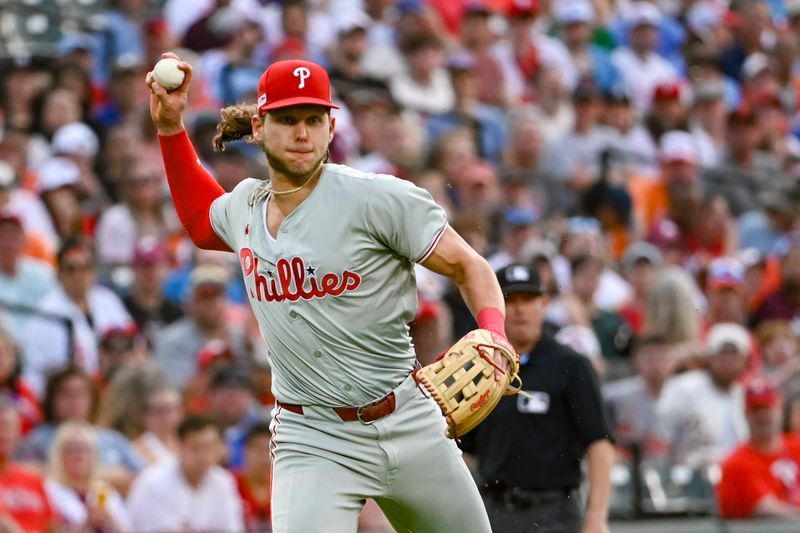 Jun 14, 2024; Baltimore, Maryland, USA;  Philadelphia Phillies third baseman Alec Bohm (28) throws to first base after fielding a second inning ground ball ]against the Baltimore Orioles at Oriole Park at Camden Yards. Mandatory Credit: Tommy Gilligan-USA TODAY Sports