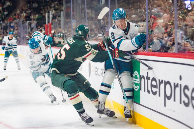 Nov 11, 2025; Saint Paul, Minnesota, USA; Minnesota Wild defenseman David Jiricek (55) checks San Jose Sharks center Will Smith (2) in the third period at Grand Casino Arena. Jiricek received a penalty. Mandatory Credit: Matt Blewett-Imagn Images