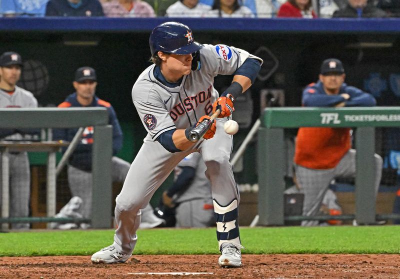 Apr 25, 2025; Kansas City, Missouri, USA;  Houston Astros center fielder Jake Meyers (6) puts down a sacrifice bunt in the sixth inning against the Kansas City Royals at Kauffman Stadium. Mandatory Credit: Peter Aiken-Imagn Images