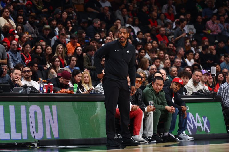 TORONTO, CANADA - FEBRUARY 22: Head Coach Kevin Ollie of the Brooklyn Nets looks on during the game against the Toronto Raptors on February 22, 2024 at the Scotiabank Arena in Toronto, Ontario, Canada.  NOTE TO USER: User expressly acknowledges and agrees that, by downloading and or using this Photograph, user is consenting to the terms and conditions of the Getty Images License Agreement.  Mandatory Copyright Notice: Copyright 2024 NBAE (Photo by Vaughn Ridley/NBAE via Getty Images)