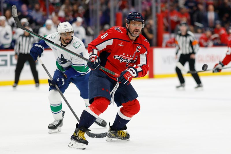 Oct 19, 2025; Washington, District of Columbia, USA; Washington Capitals left wing Alex Ovechkin (8) chases the puck in front of Vancouver Canucks left wing Evander Kane (91) during the third period at Capital One Arena. Mandatory Credit: Geoff Burke-Imagn Images