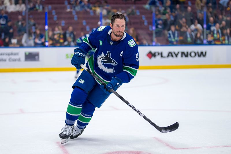 Oct 9, 2024; Vancouver, British Columbia, CAN; Vancouver Canucks forward J.T. Miller (9) skates during warm up prior to a game against the Calgary Flames at Rogers Arena. Mandatory Credit: Bob Frid-Imagn Images