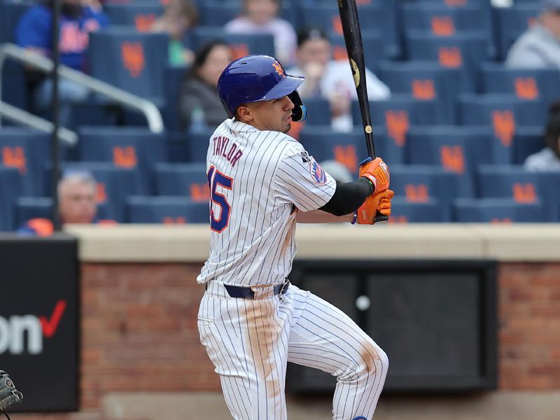 Apr 17, 2024; New York City, New York, USA; New York Mets right fielder Tyrone Taylor (15) follows through on a two run single against the Pittsburgh Pirates during the sixth inning at Citi Field. Mandatory Credit: Brad Penner-USA TODAY Sports