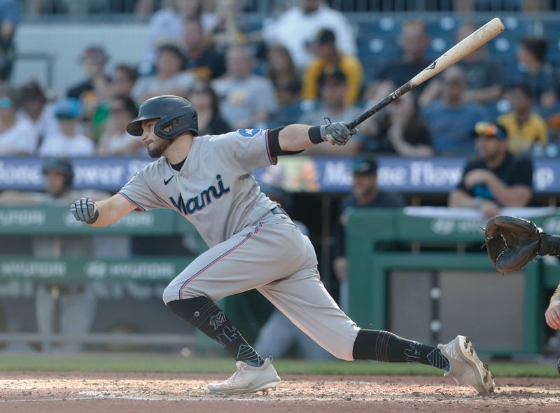 Oct 1, 2023; Pittsburgh, Pennsylvania, USA;  Miami Marlins center fielder Garrett Hampson (1) hits a single against the Pittsburgh Pirates during the seventh inning at PNC Park. Pittsburgh won 3-0. Mandatory Credit: Charles LeClaire-USA TODAY Sports