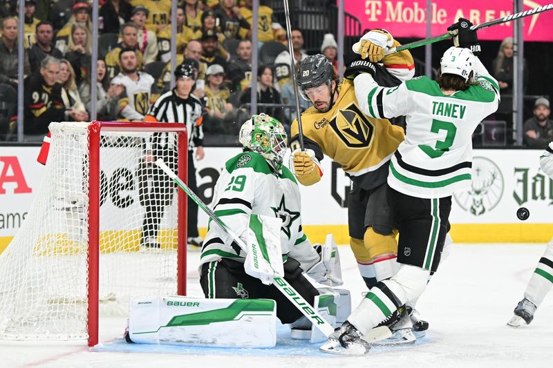 Apr 27, 2024; Las Vegas, Nevada, USA; Vegas Golden Knights center Chandler Stephenson (20) battles with Dallas Stars defenseman Chris Tanev (3) in front of goaltender Jake Oettinger (29) in the first period in game three of the first round of the 2024 Stanley Cup Playoffs at T-Mobile Arena. Mandatory Credit: Candice Ward-USA TODAY Sports