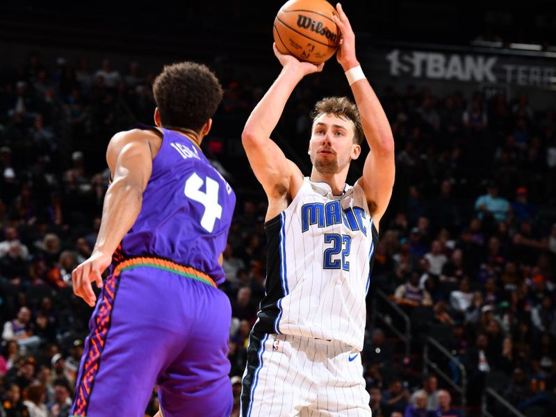 PHOENIX, AZ - NOVEMBER 18: Franz Wagner #22 of the Orlando Magic shoots a three point basket during the game against the Phoenix Suns on November 18, 2024 at Footprint Center in Phoenix, Arizona. NOTE TO USER: User expressly acknowledges and agrees that, by downloading and or using this photograph, user is consenting to the terms and conditions of the Getty Images License Agreement. Mandatory Copyright Notice: Copyright 2024 NBAE (Photo by Barry Gossage/NBAE via Getty Images)