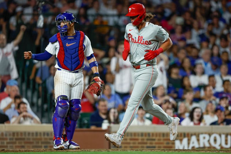 Jul 3, 2024; Chicago, Illinois, USA; Philadelphia Phillies third baseman Alec Bohm (28) scores against the Chicago Cubs during the eight inning at Wrigley Field. Mandatory Credit: Kamil Krzaczynski-USA TODAY Sports