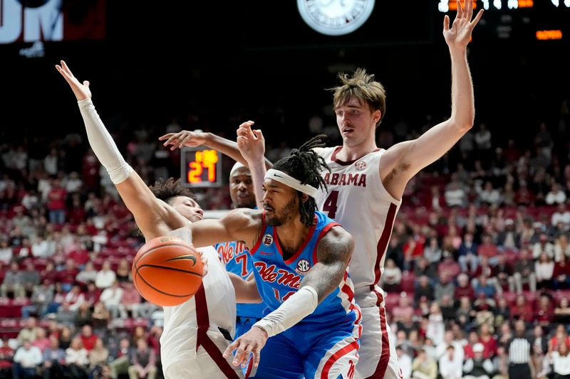 an 14, 2025; Tuscaloosa, AL, USA; Ole Miss guard Davon Barnes (7) hooks Alabama guard Mark Sears (1) as Alabama forward Grant Nelson (4) pressures Ole Miss guard Dre Davis (14) at Coleman Coliseum. Ole Miss defeated Alabama 74-64. Mandatory Credit: Gary Cosby Jr./USA TODAY Network via Imagn Images