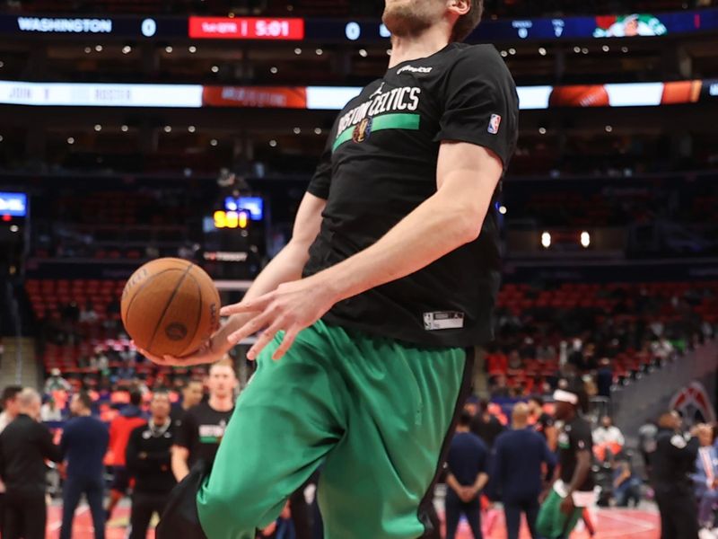 WASHINGTON, DC -? NOVEMBER 22:  Luke Kornet #40 of the Boston Celtics handles the ball during warmups against the Washington Wizards during the NBA Emirates Cup game on November 22, 2024 at Capital One Arena in Washington, DC. NOTE TO USER: User expressly acknowledges and agrees that, by downloading and or using this Photograph, user is consenting to the terms and conditions of the Getty Images License Agreement. Mandatory Copyright Notice: Copyright 2024 NBAE (Photo by Kenny Giarla/NBAE via Getty Images)