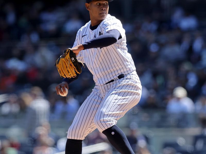 Apr 2, 2023; Bronx, New York, USA; New York Yankees starting pitcher Jhony Brito (76) pitches against the San Francisco Giants during the first inning at Yankee Stadium. Mandatory Credit: Brad Penner-USA TODAY Sports