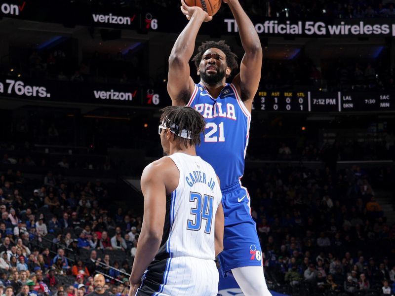 PHILADELPHIA, PA - JANUARY 30: Joel Embiid #21 of the Philadelphia 76ers shoots the ball during the game against the Orlando Magic on January 30, 2023 at the Wells Fargo Center in Philadelphia, Pennsylvania NOTE TO USER: User expressly acknowledges and agrees that, by downloading and/or using this Photograph, user is consenting to the terms and conditions of the Getty Images License Agreement. Mandatory Copyright Notice: Copyright 2023 NBAE (Photo by Jesse D. Garrabrant/NBAE via Getty Images)