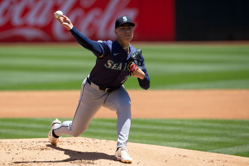 Jun 6, 2024; Oakland, California, USA; Seattle Mariners starting pitcher Bryan Woo (22) delivers a pitch against the Oakland Athletics during the first inning at Oakland-Alameda County Coliseum. Mandatory Credit: D. Ross Cameron-USA TODAY Sports