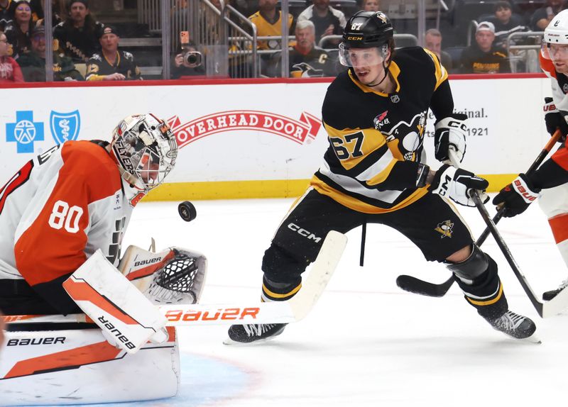 Mar 7, 2026; Pittsburgh, Pennsylvania, USA;  Philadelphia Flyers goaltender Dan Vladar (80) makes a save against Pittsburgh Penguins right wing Rickard Rakell (67) in overtime at PPG Paints Arena. Mandatory Credit: Charles LeClaire-Imagn Images