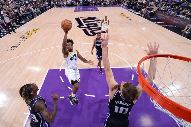 SACRAMENTO, CA - MARCH 31: Colin Sexton #2 of the Utah Jazz drives to the basket during the game against the Sacramento Kings on March 31, 2024 at Golden 1 Center in Sacramento, California. NOTE TO USER: User expressly acknowledges and agrees that, by downloading and or using this Photograph, user is consenting to the terms and conditions of the Getty Images License Agreement. Mandatory Copyright Notice: Copyright 2024 NBAE (Photo by Rocky Widner/NBAE via Getty Images)