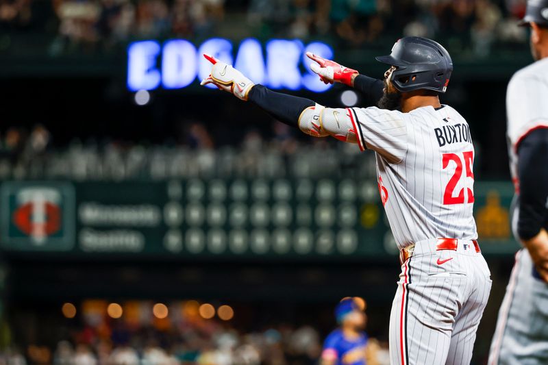 May 30, 2025; Seattle, Washington, USA; Minnesota Twins center fielder Byron Buxton (25) celebrates after hitting a two-run single against the Seattle Mariners during the tenth inning at T-Mobile Park. Mandatory Credit: Joe Nicholson-Imagn Images