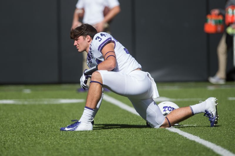 Nov 2, 2019; Stillwater, OK, USA; TCU Horned Frogs linebacker Zach Marcheselli (34) stretches before a game against the Oklahoma State Cowboys Boone Pickens Stadium. Mandatory Credit: Brett Rojo-USA TODAY Sports