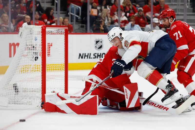 Oct 15, 2025; Detroit, Michigan, USA;  Detroit Red Wings goaltender Cam Talbot (39) makes the save on Florida Panthers center Anton Lundell (15) in the first period at Little Caesars Arena. Mandatory Credit: Rick Osentoski-Imagn Images