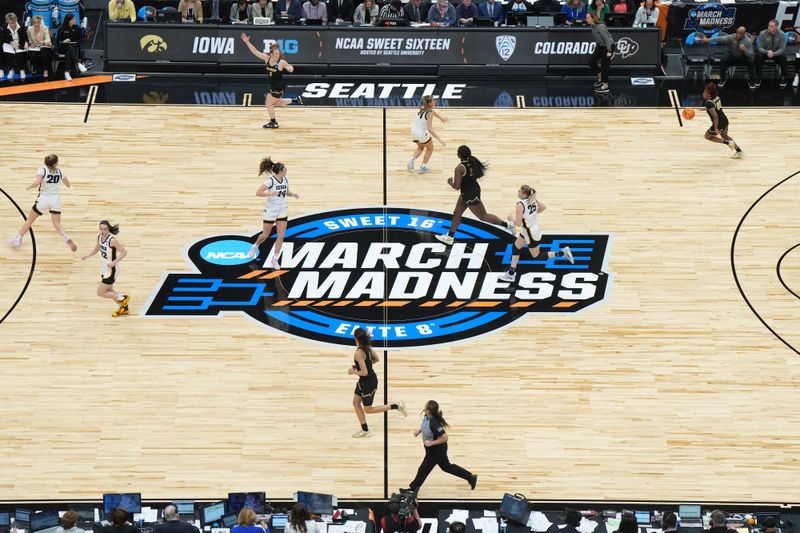 Mar 24, 2023; Seattle, WA, USA; A general overall view of the March Madness Sweet 16 and Elite 8 logo at center court at Climate Pledge Arena. Mandatory Credit: Kirby Lee-USA TODAY Sports