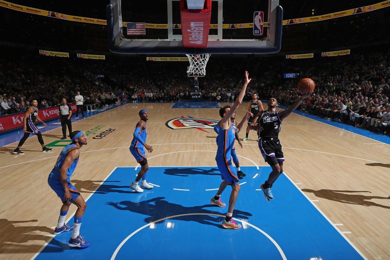 OKLAHOMA CITY, OK - APRIL 9:  De'Aaron Fox #5 of the Sacramento Kings shoots the ball during the game against the Oklahoma City Thunder on April 9, 2024 at Paycom Arena in Oklahoma City, Oklahoma. NOTE TO USER: User expressly acknowledges and agrees that, by downloading and or using this photograph, User is consenting to the terms and conditions of the Getty Images License Agreement. Mandatory Copyright Notice: Copyright 2024 NBAE (Photo by Zach Beeker/NBAE via Getty Images)