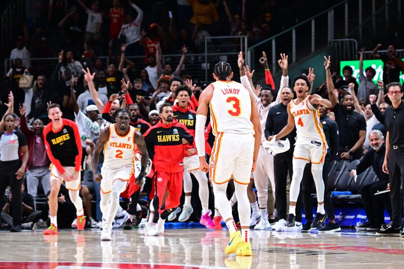 ATLANTA, GA - OCTOBER 8: Seth Lundy #3 of the Atlanta Hawks celebrates after scoring the game winning shot against the Indiana Pacers during a NBA preseason game on October 8, 2024 at State Farm Arena in Atlanta, Georgia.  NOTE TO USER: User expressly acknowledges and agrees that, by downloading and/or using this Photograph, user is consenting to the terms and conditions of the Getty Images License Agreement. Mandatory Copyright Notice: Copyright 2024 NBAE (Photo by Adam Hagy/NBAE via Getty Images)