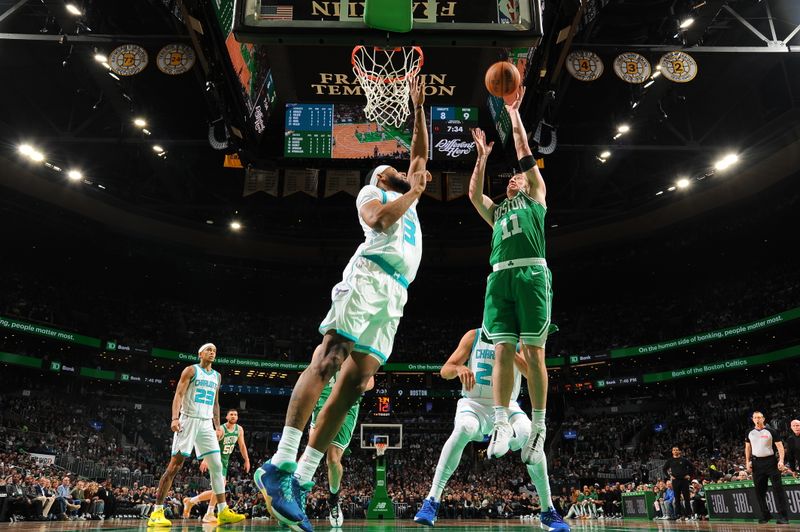 BOSTON, MA - APRIL 12: Payton Pritchard #11 of the Boston Celtics drives to the basket during the game against the Charlotte Hornets on April 12, 2024 at the TD Garden in Boston, Massachusetts. NOTE TO USER: User expressly acknowledges and agrees that, by downloading and or using this photograph, User is consenting to the terms and conditions of the Getty Images License Agreement. Mandatory Copyright Notice: Copyright 2024 NBAE  (Photo by Brian Babineau/NBAE via Getty Images)