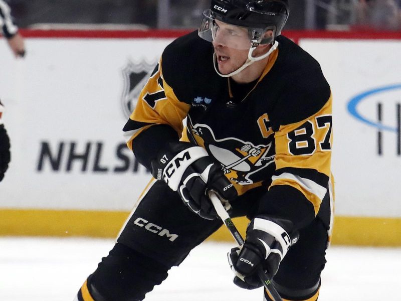 Feb 25, 2024; Pittsburgh, Pennsylvania, USA;  Pittsburgh Penguins center Sidney Crosby (87) skates up ice with the puck against the Philadelphia Flyers during the second period at PPG Paints Arena. Mandatory Credit: Charles LeClaire-USA TODAY Sports