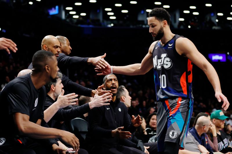 NEW YORK, NEW YORK - JANUARY 29: Ben Simmons #10 of the Brooklyn Nets reacts with the bench during the second half against the Utah Jazz at Barclays Center on January 29, 2024 in the Brooklyn borough of New York City. The Nets won 147-114. NOTE TO USER: User expressly acknowledges and agrees that, by downloading and/or using this Photograph, user is consenting to the terms and conditions of the Getty Images License Agreement. (Photo by Sarah Stier/Getty Images)