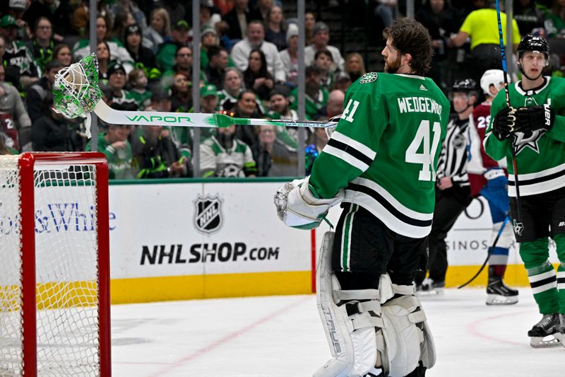 Jan 4, 2024; Dallas, Texas, USA; Dallas Stars goaltender Scott Wedgewood (41) loses his helmet as he faces the Colorado Avalanche attack during the first period at the American Airlines Center. Mandatory Credit: Jerome Miron-USA TODAY Sports