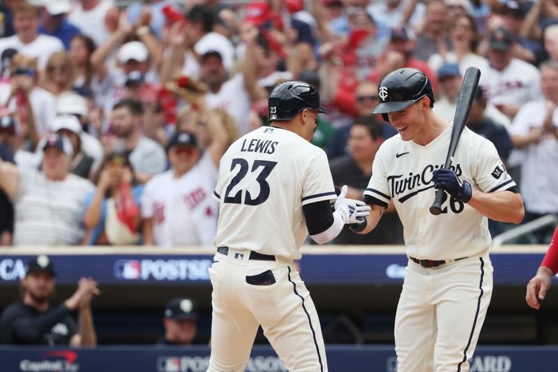 Oct 3, 2023; Minneapolis, Minnesota, USA; Minnesota Twins short stop Royce Lewis (23) celebrates with right fielder Max Kepler (26) after hitting a home run in the third inning against the Toronto Blue Jays during game one of the Wildcard series for the 2023 MLB playoffs at Target Field. Mandatory Credit: Jesse Johnson-USA TODAY Sports