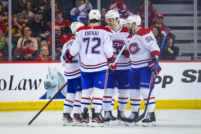 Mar 16, 2024; Calgary, Alberta, CAN; Montreal Canadiens right wing Cole Caufield (22) celebrates his goal with teammates against the Calgary Flames during the second period at Scotiabank Saddledome. Mandatory Credit: Sergei Belski-USA TODAY Sports