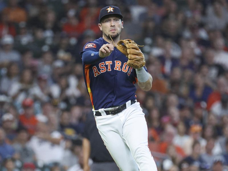 Aug 1, 2023; Houston, Texas, USA; Houston Astros third baseman Alex Bregman (2) throws out a runner at first base during the second inning against the Cleveland Guardians at Minute Maid Park. Mandatory Credit: Troy Taormina-USA TODAY Sports