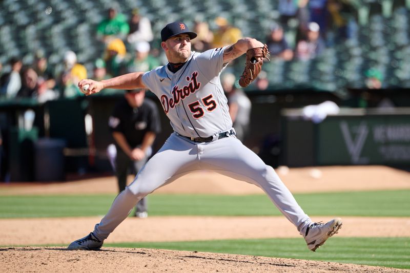 Sep 24, 2023; Oakland, California, USA; Detroit Tigers pitcher Alex Lange (55) throws a pitch against the Oakland Athletics during the ninth inning at Oakland-Alameda County Coliseum. Mandatory Credit: Robert Edwards-USA TODAY Sports