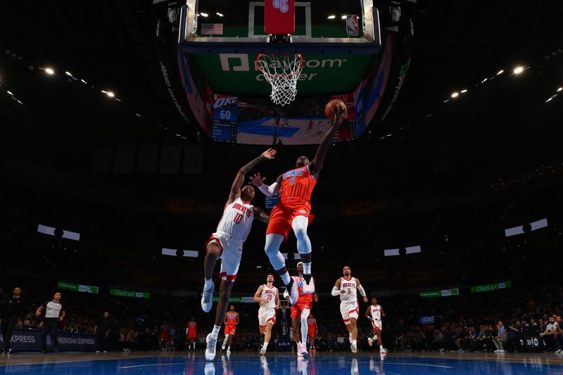 OKLAHOMA CITY, OK - FEBRUARY 27: Luguentz Dort #5 of the Oklahoma City Thunder drives to the basket during the game against the Houston Rockets on February, 2024 at Paycom Arena in Oklahoma City, Oklahoma. NOTE TO USER: User expressly acknowledges and agrees that, by downloading and or using this photograph, User is consenting to the terms and conditions of the Getty Images License Agreement. Mandatory Copyright Notice: Copyright 2024 NBAE (Photo by Zach Beeker/NBAE via Getty Images)