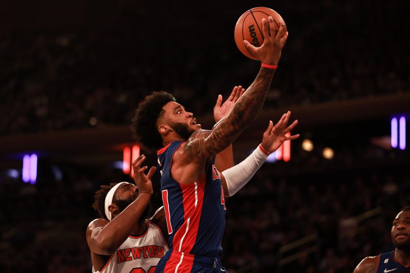 NEW YORK, NEW YORK - OCTOBER 21: Saddiq Bey #41 of the Detroit Pistons shoots a layup defended by Mitchell Robinson #23 of the New York Knicks during the second quarter of the game against the New York Knicks at Madison Square Garden on October 21, 2022 in New York City. NOTE TO USER: User expressly acknowledges and agrees that,  by downloading and or using this photograph,  User is consenting to the terms and conditions of the Getty Images License Agreement. (Photo by Dustin Satloff/Getty Images)