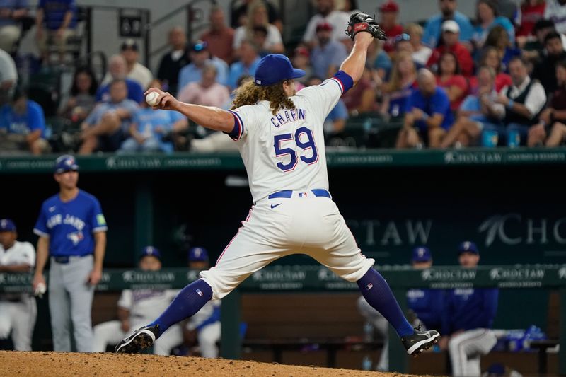 Sep 19, 2024; Arlington, Texas, USA; Texas Rangers pitcher Andrew Chafin (59) throws to the plate during the eighth inning against the Toronto Blue Jays at Globe Life Field. Mandatory Credit: Raymond Carlin III-Imagn Images