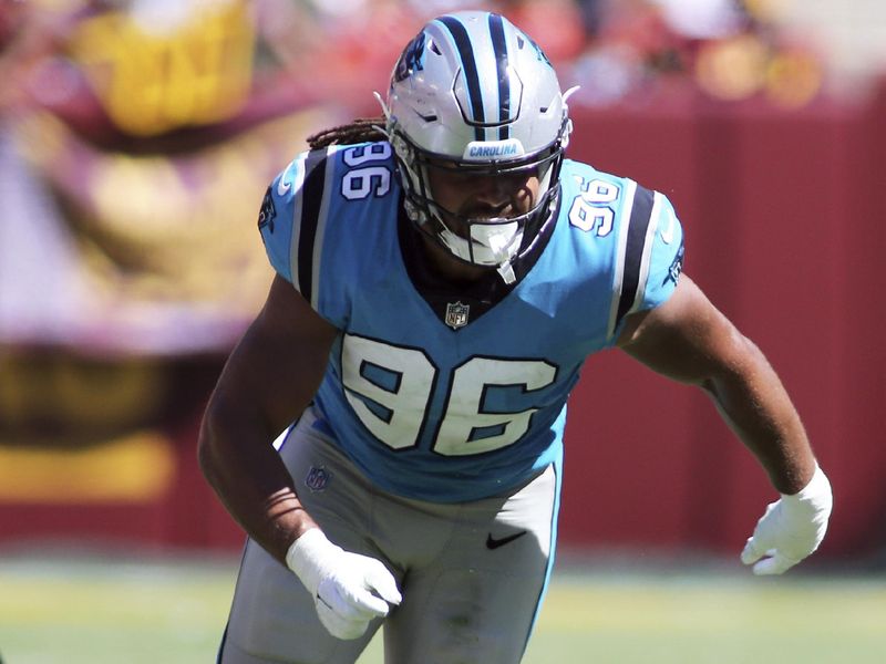 Carolina Panthers defensive end Austin Larkin (96) runs during an NFL football game against the Washington Commanders, Saturday, Aug. 13, 2022 in Landover. (AP Photo/Daniel Kucin Jr.)