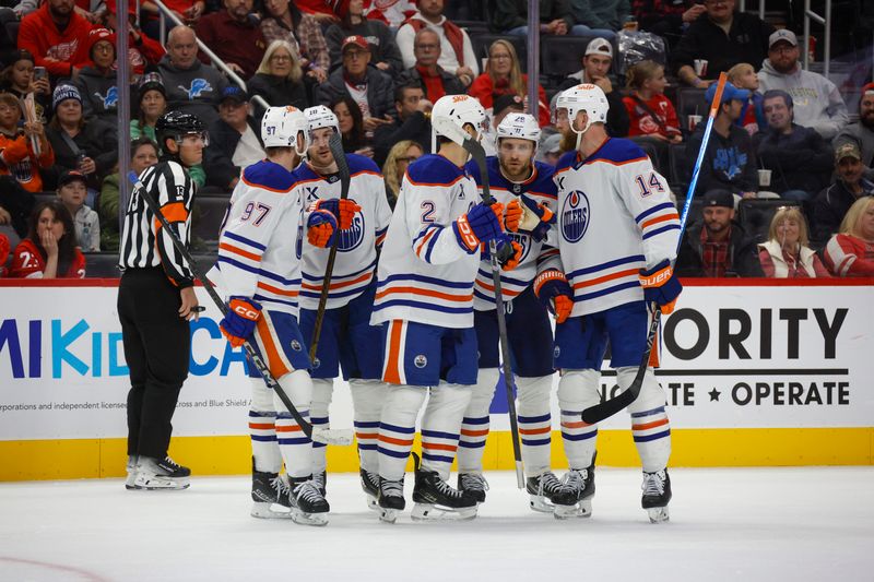 Oct 27, 2024; Detroit, Michigan, USA; Edmonton Oilers defenseman Evan Bouchard (2) celebrates a goal scored in the third period with teammates at Little Caesars Arena. Mandatory Credit: Brian Bradshaw Sevald-Imagn Images